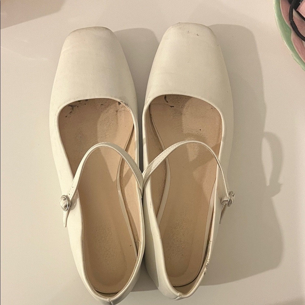 White ballet flats with strap
